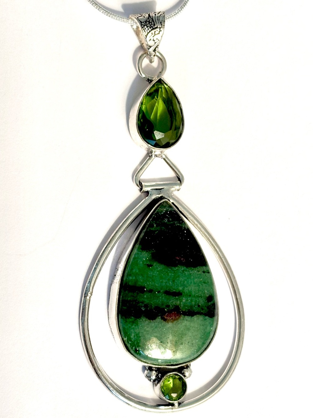 3 inch, hinged, 925 marked, Ruby Zoisite and Peridot pendant on silver chain.